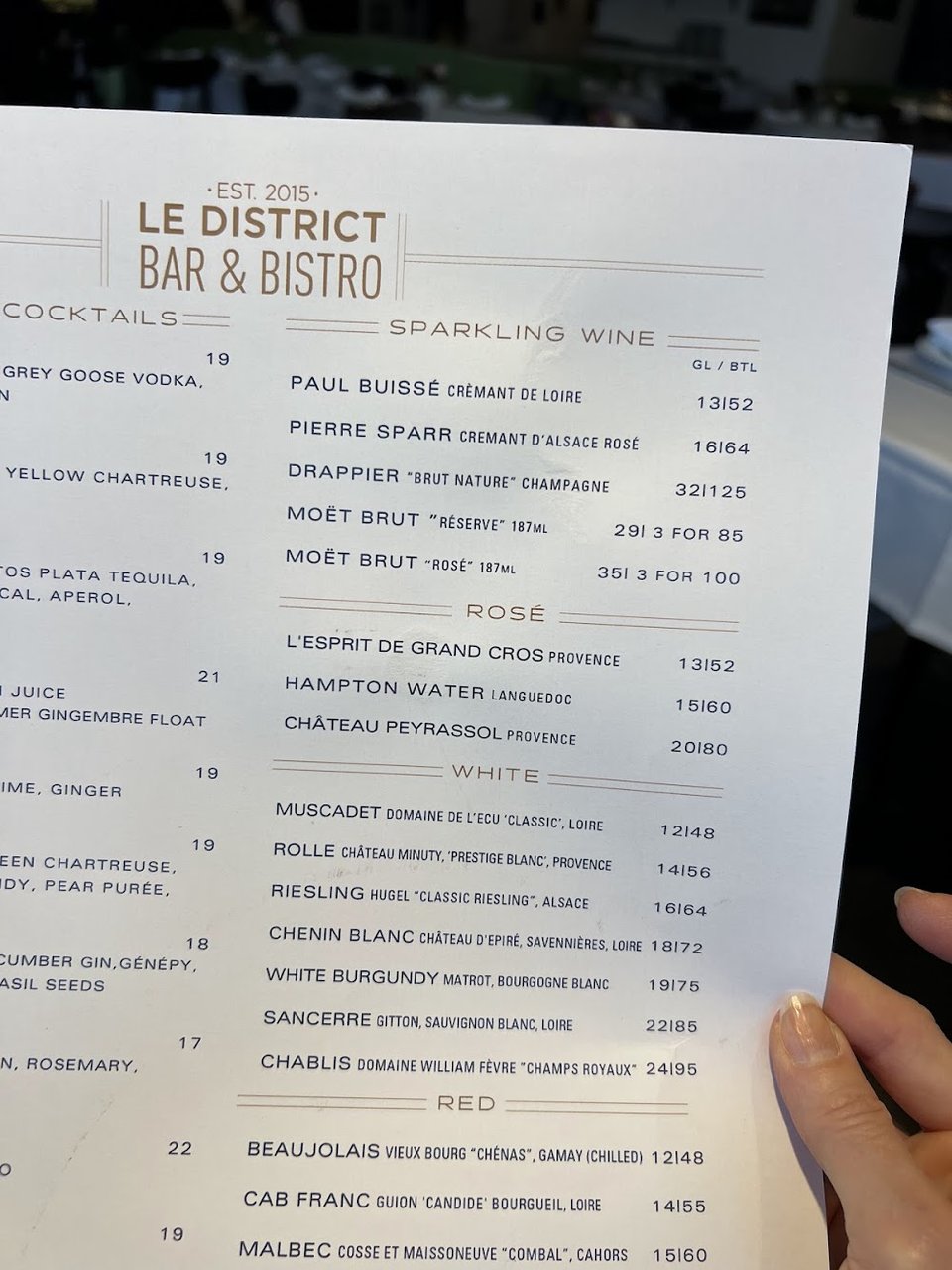 Printed menu showing breakfast and sides.